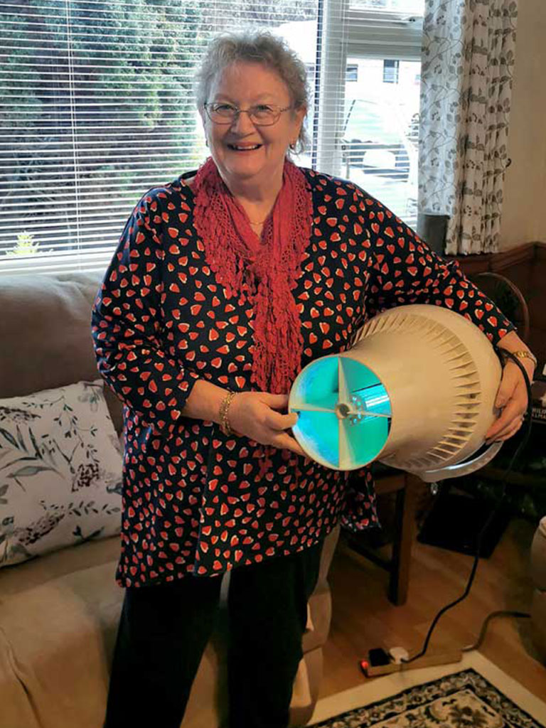 Anne Lord holding stood holding fan